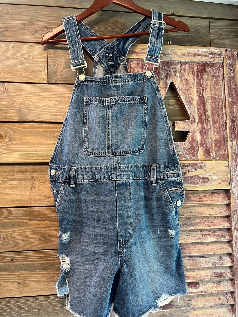 GAP Women’s Distressed Denim Short Overalls in Faded Blue